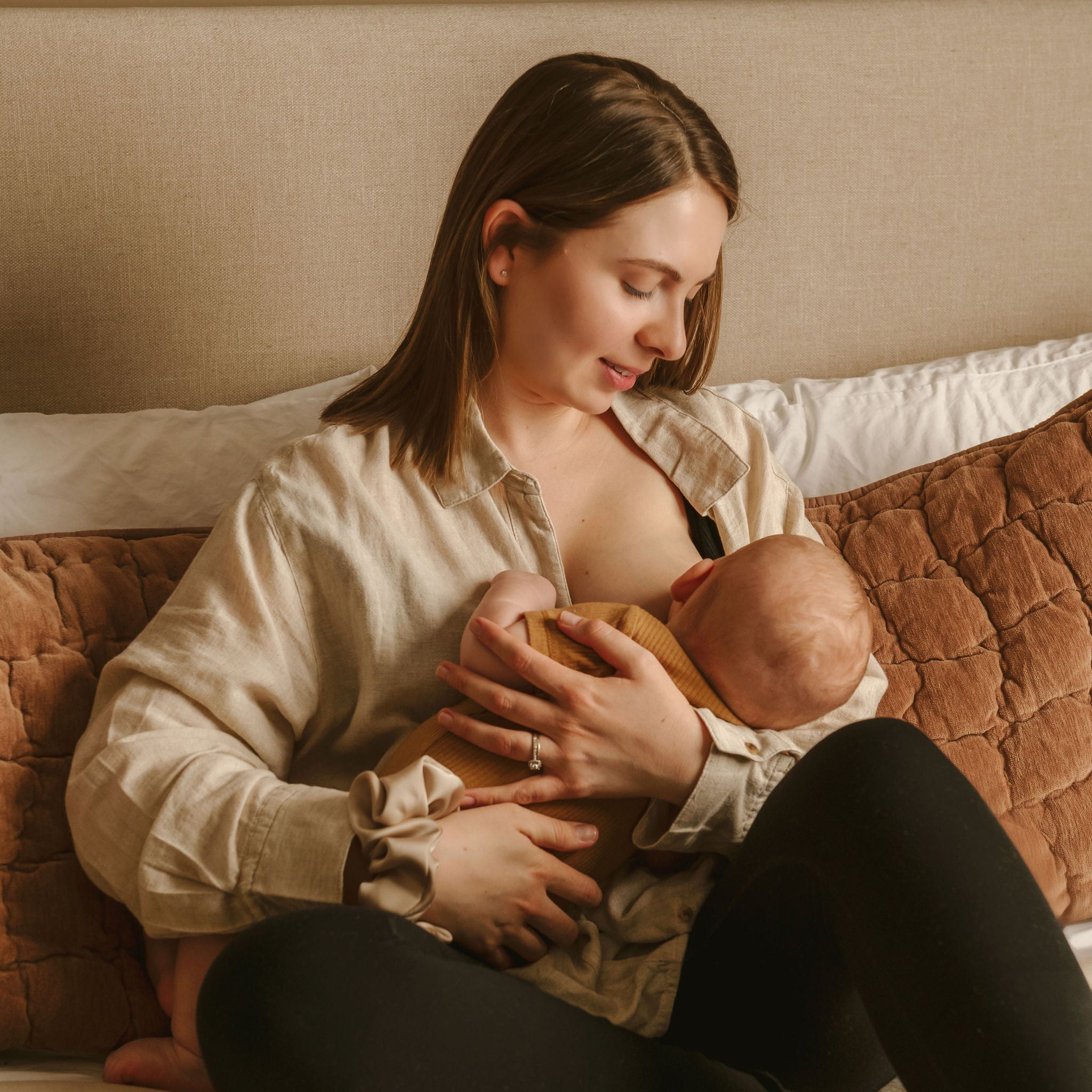 breastfeeding mom using Le Lolo colored nipple shield for improved latch