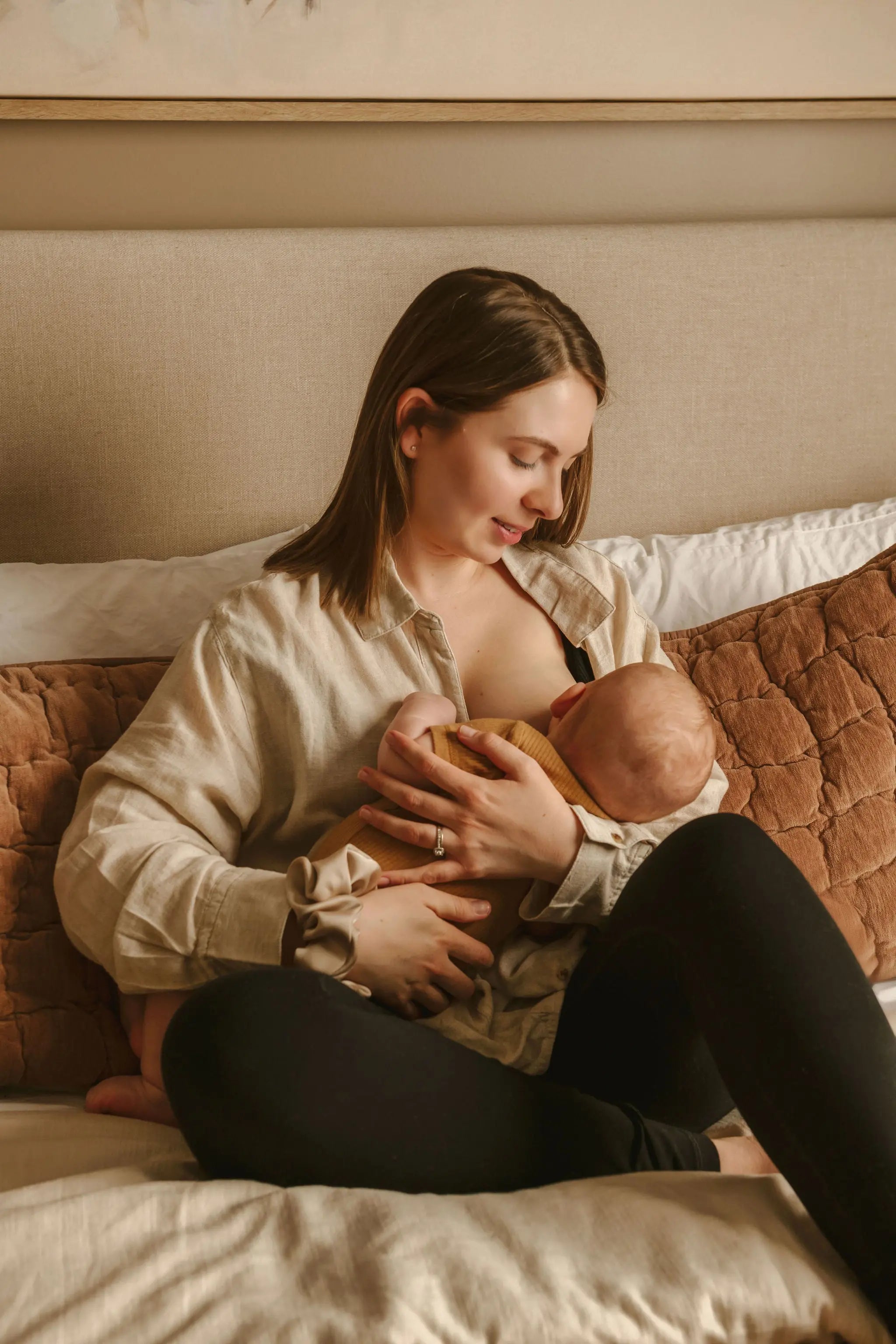 breastfeeding mom using Le Lolo colored nipple shield for improved latch