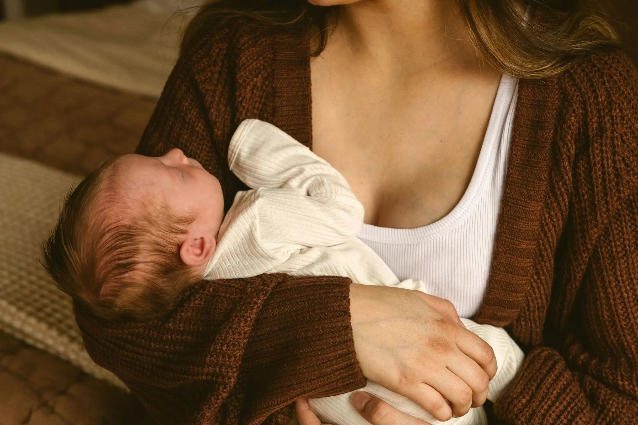 new mom holding newborn baby