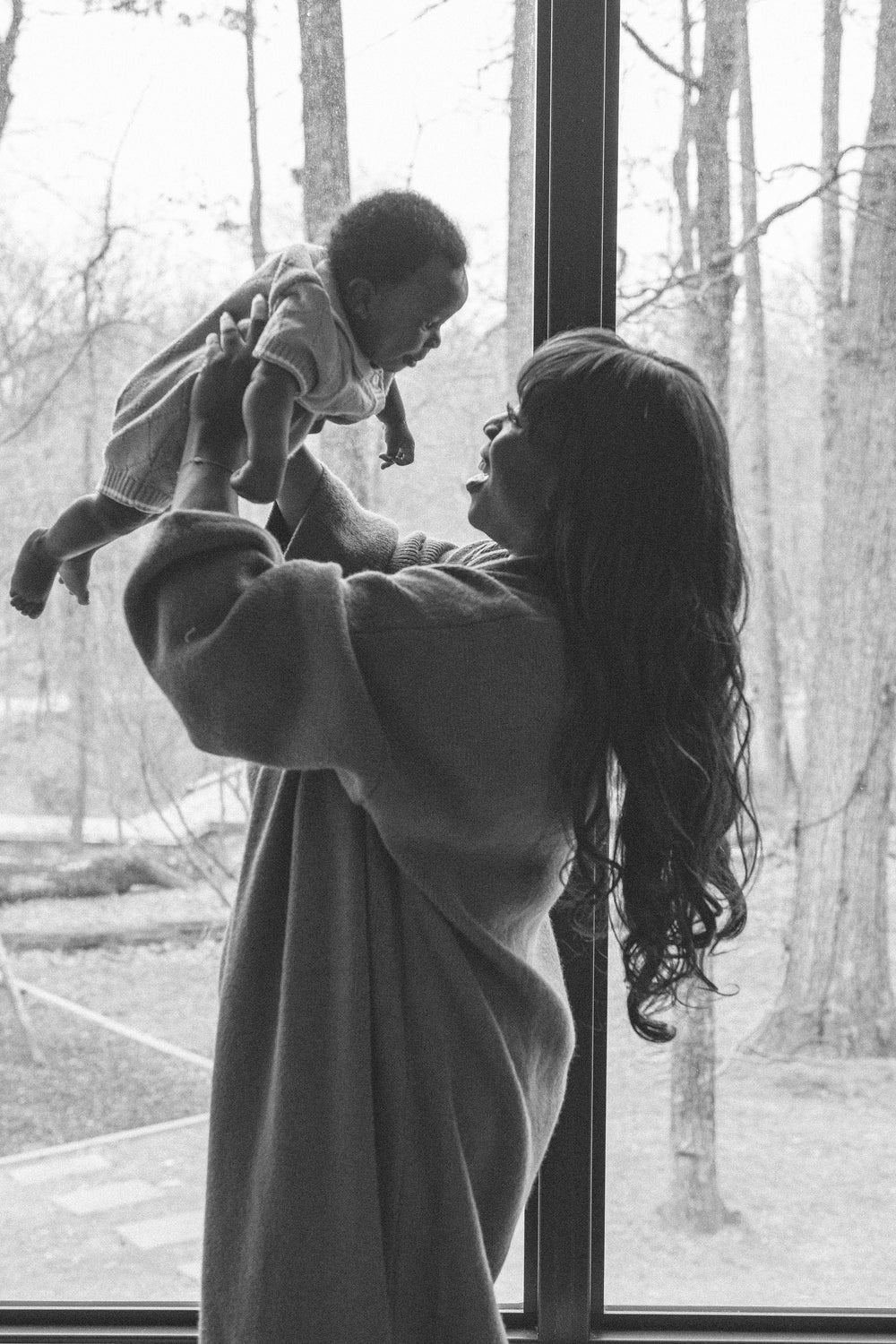 postpartum mom holding new baby