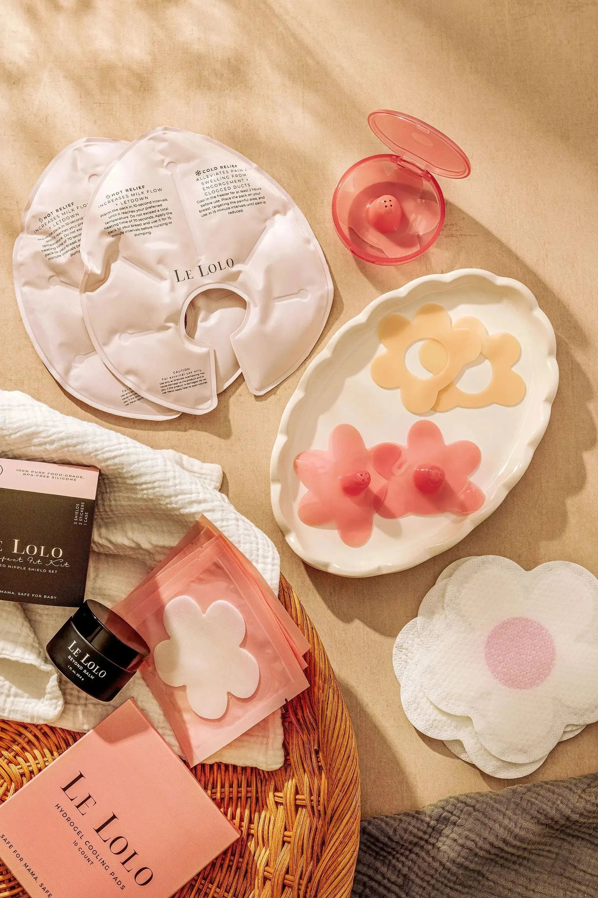 essentials for every breastfeeding mom including disposable nursing pads, color nipple shields, hot and cold ice packs, organic nipple balm and hydrogel cooling pads