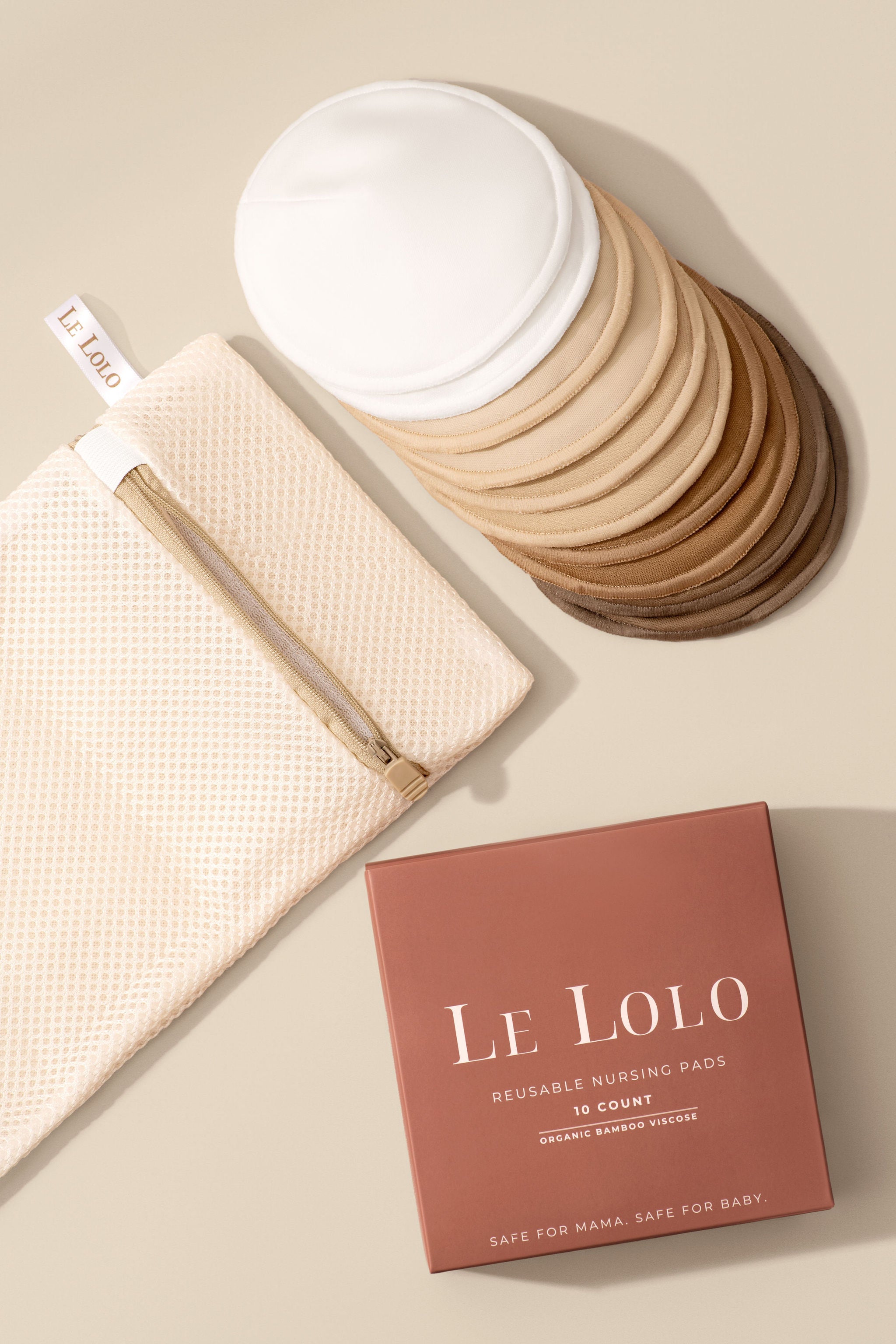 Le Lolo washable bamboo nursing pads with included laundry bag for convenient cleaning and reuse.