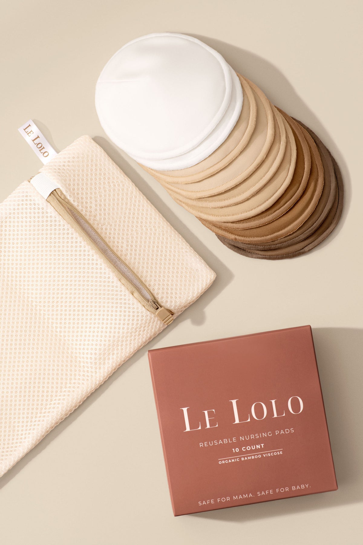 Le Lolo washable bamboo nursing pads with included laundry bag for convenient cleaning and reuse.